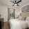 bedroom with plush carpet and view through windows