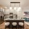 a kitchen with a large island open to living room