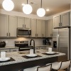 under cabinet lighting in spacious kitchen with island